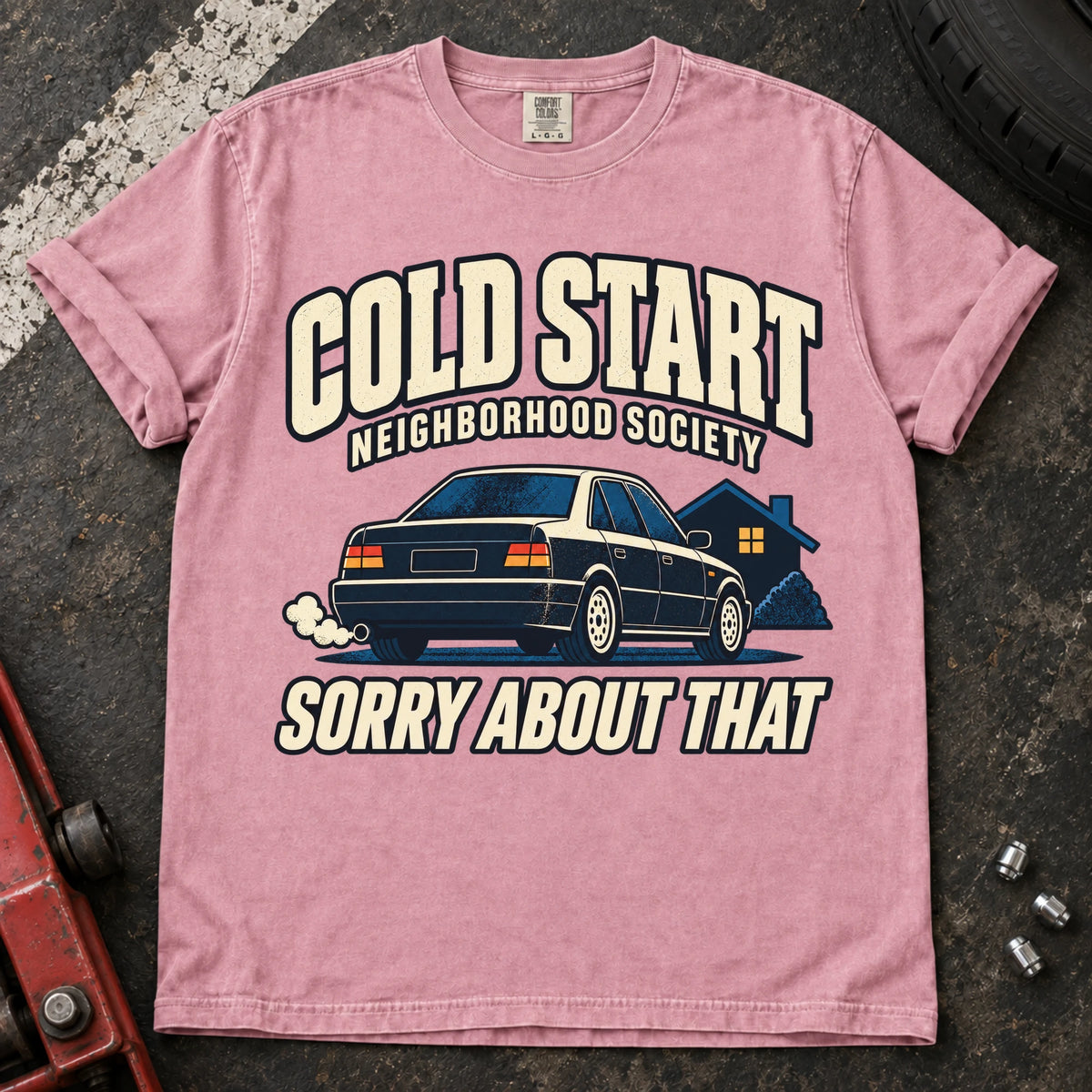 Blossom car enthusiast T-shirt. A car outside a house apologizes for the Cold Start Neighborhood Society.