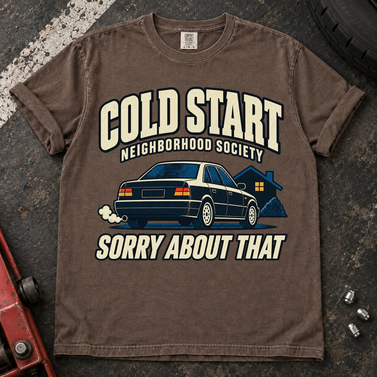 Espresso car enthusiast T-shirt. A car outside a house apologizes for the Cold Start Neighborhood Society.