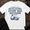 White gaming T-shirt. A cracked potion and fallen crown celebrate outliving every bad decision so far.