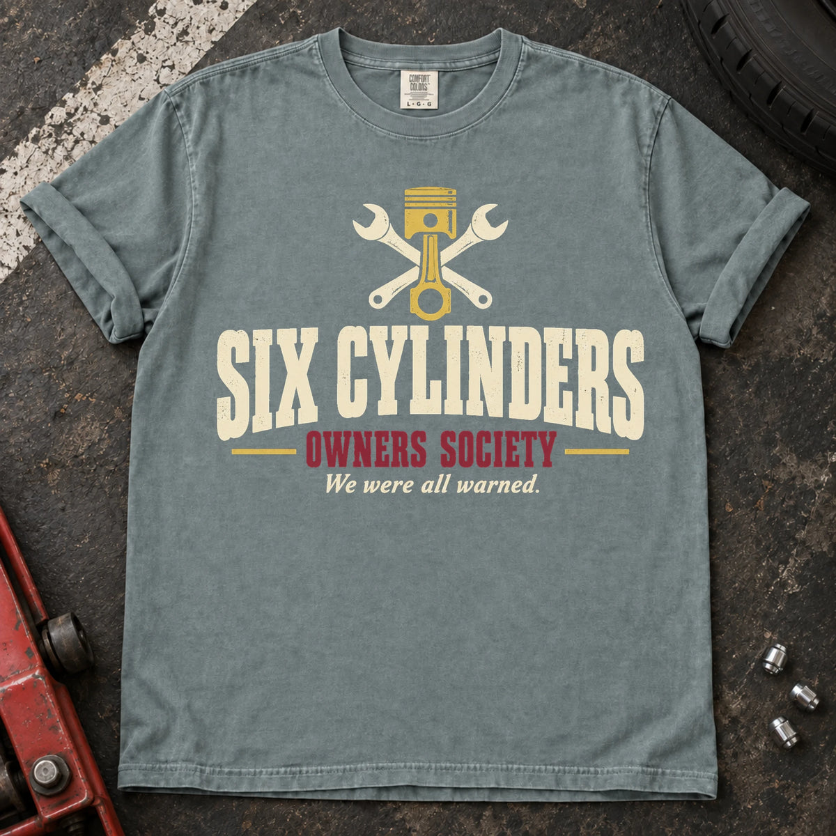 Bay car enthusiast T-shirt. A piston and crossed wrenches welcome the Six Cylinders Owners Society.