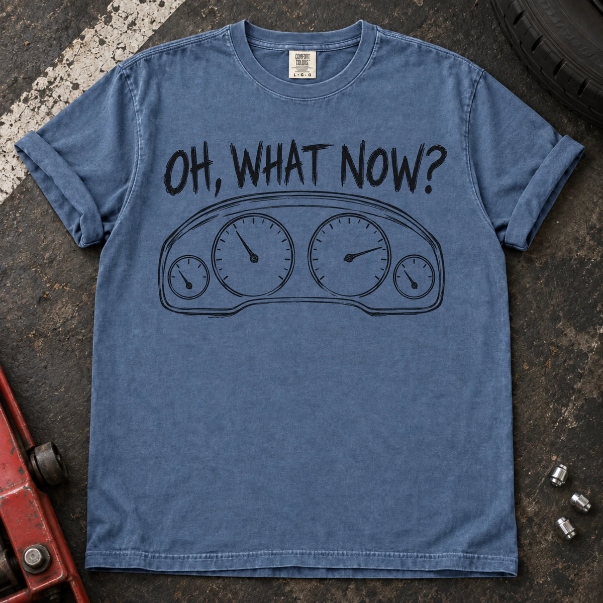 Blue Jean car enthusiast T-shirt. An instrument cluster meets the familiar car-owner question, oh, what now?