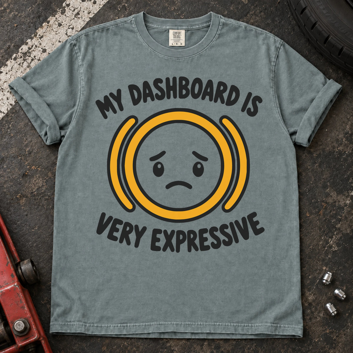 Bay T-shirt showing a worried face inside an amber warning symbol with 'My dashboard is very expressive'.