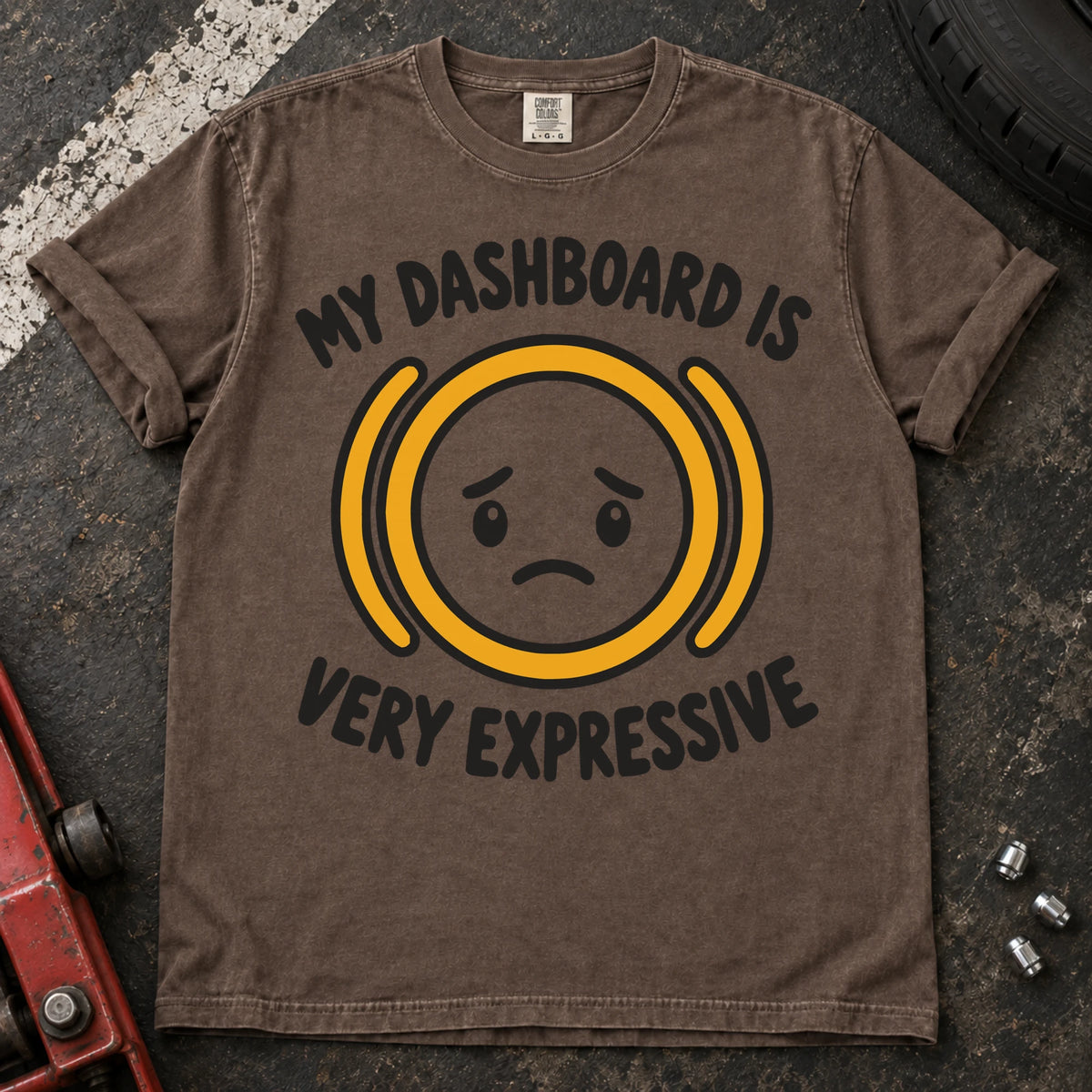 Espresso T-shirt showing a worried face inside an amber warning symbol with 'My dashboard is very expressive'.