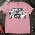 Blossom T-shirt reading 'Currently troubleshooting everything' above a small diagnostic connector.