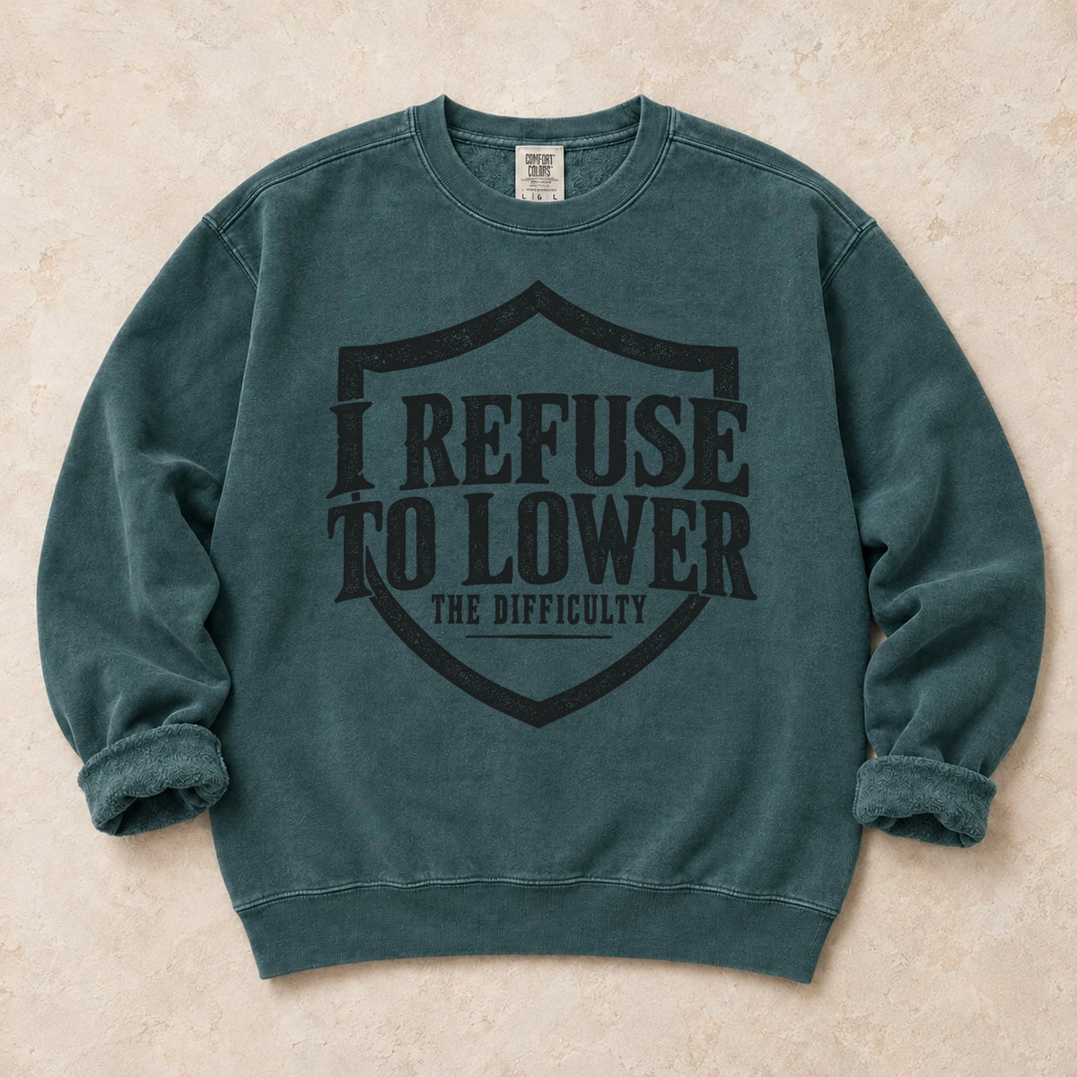 Blue Spruce gaming sweatshirt. A shield frames the refusal to lower the difficulty.