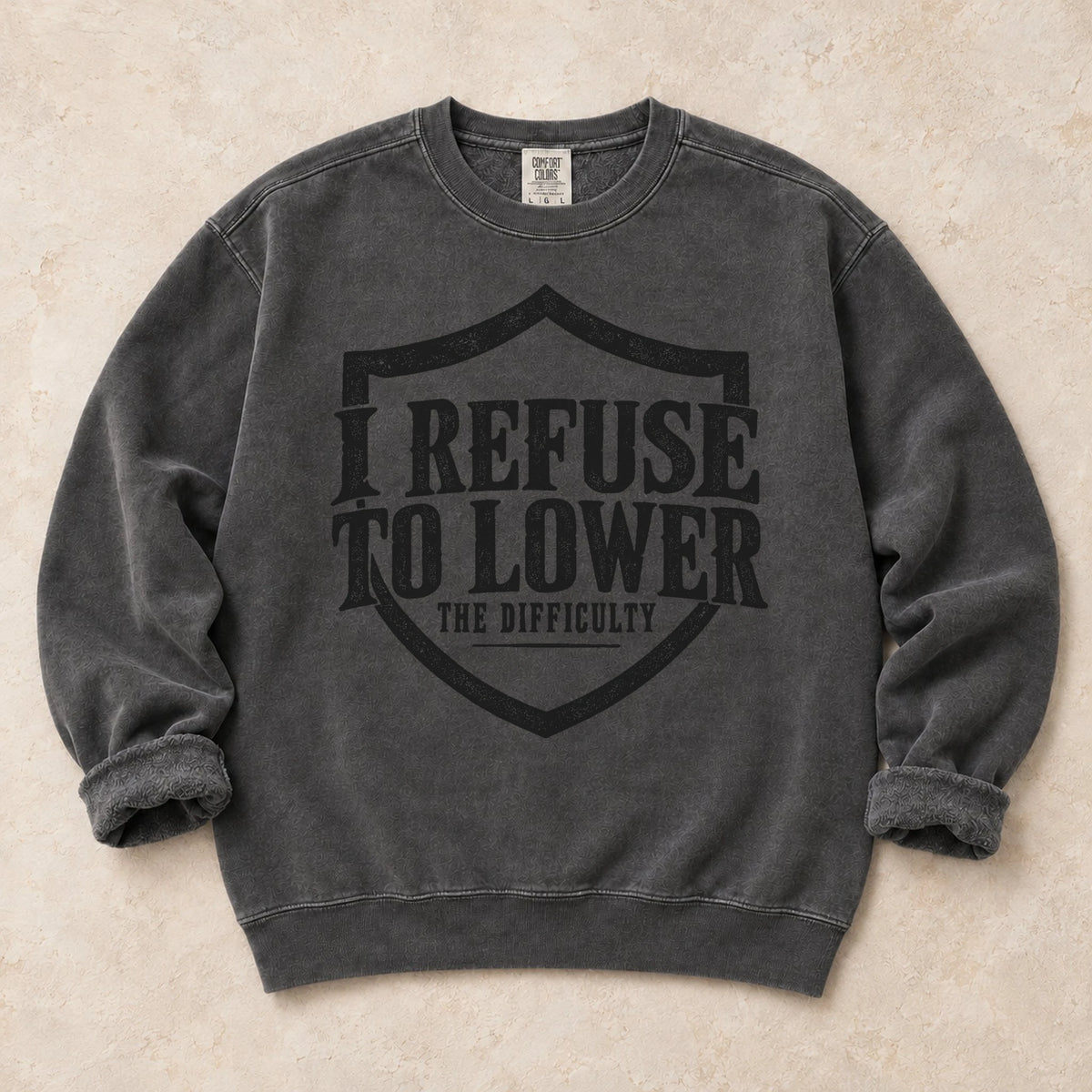 Pepper gaming sweatshirt. A shield frames the refusal to lower the difficulty.