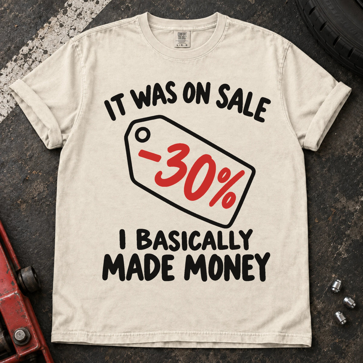Ivory T-shirt with a 30% discount tag and 'It was on sale. I basically made money'.