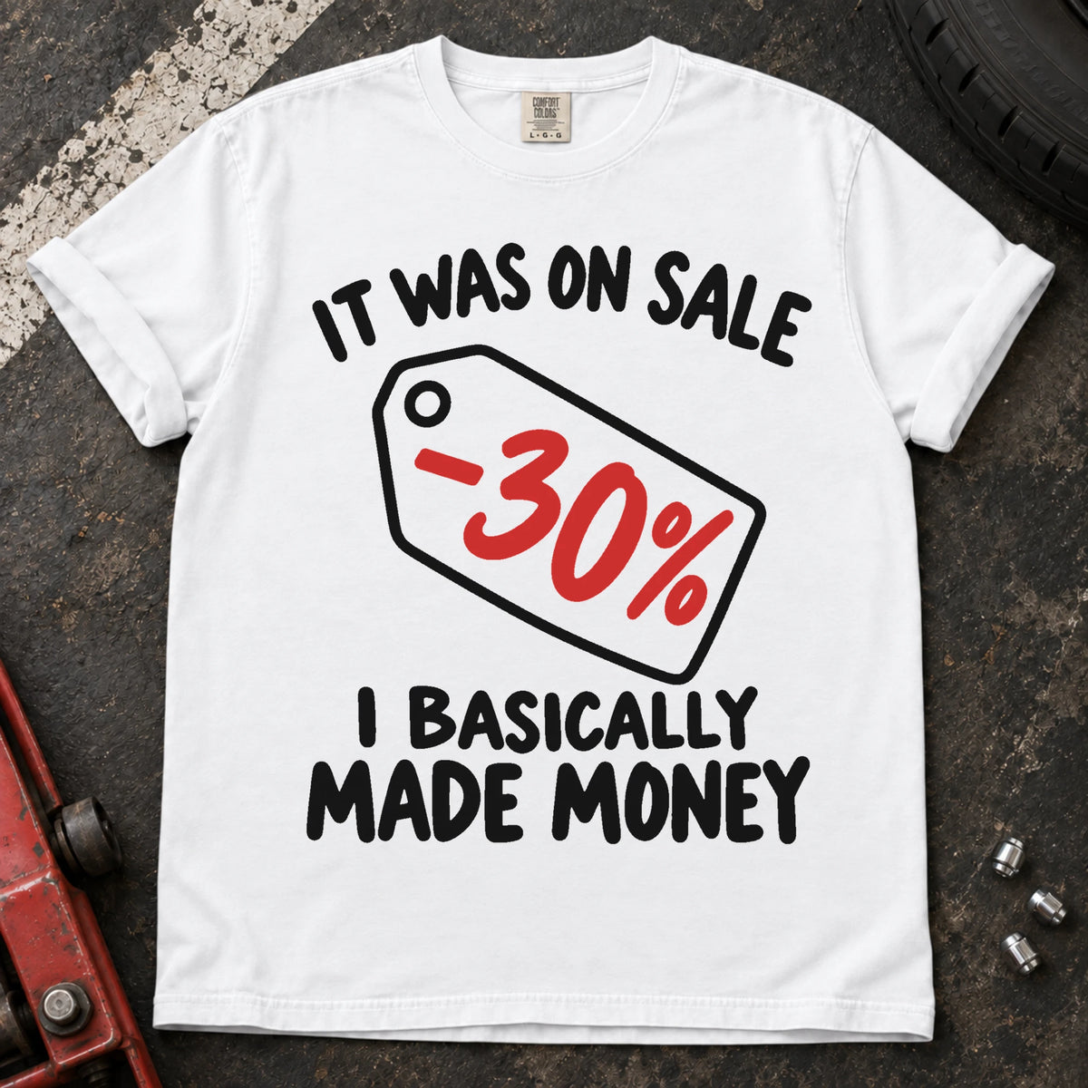 White T-shirt with a 30% discount tag and 'It was on sale. I basically made money'.