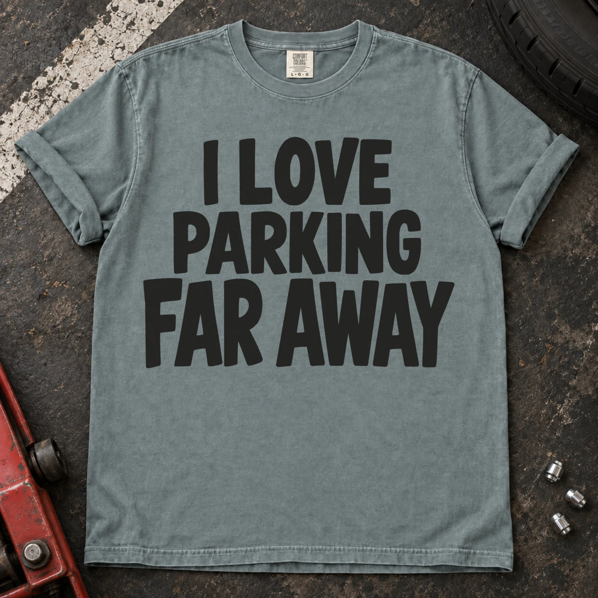Bay T-shirt with bold stacked lettering reading 'I love parking far away'.