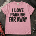 Blossom T-shirt with bold stacked lettering reading 'I love parking far away'.