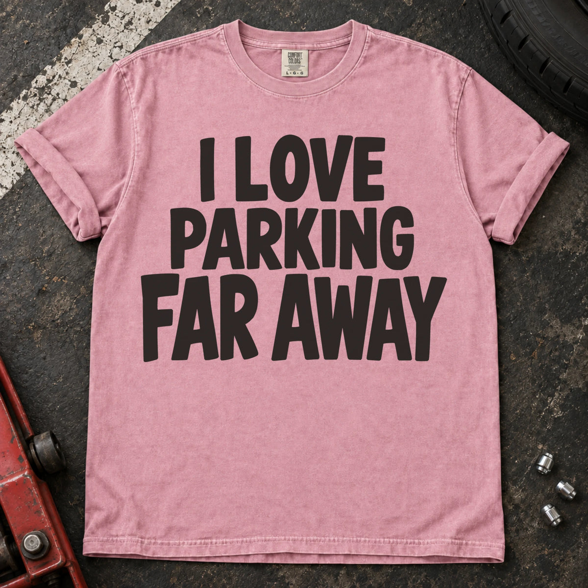 Blossom T-shirt with bold stacked lettering reading 'I love parking far away'.