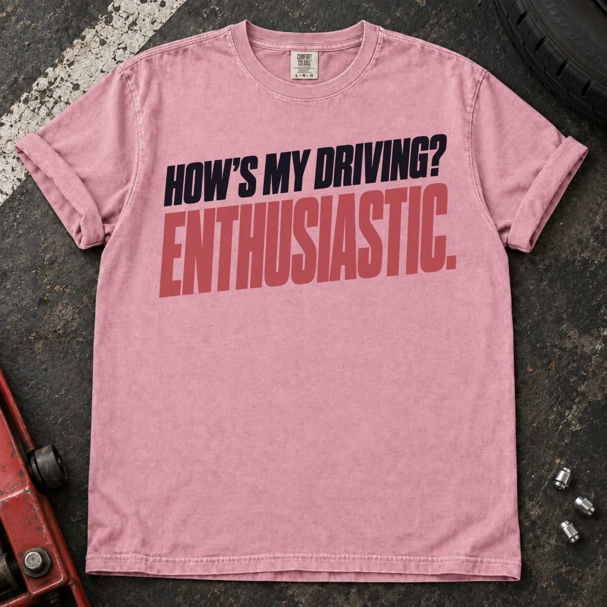 Blossom car enthusiast T-shirt. How's my driving? Enthusiastic. Bold lettering for the self-aware car lover.