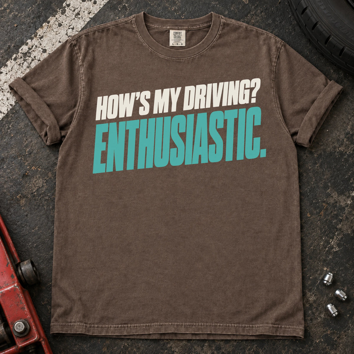 Espresso car enthusiast T-shirt. How's my driving? Enthusiastic. Bold lettering for the self-aware car lover.