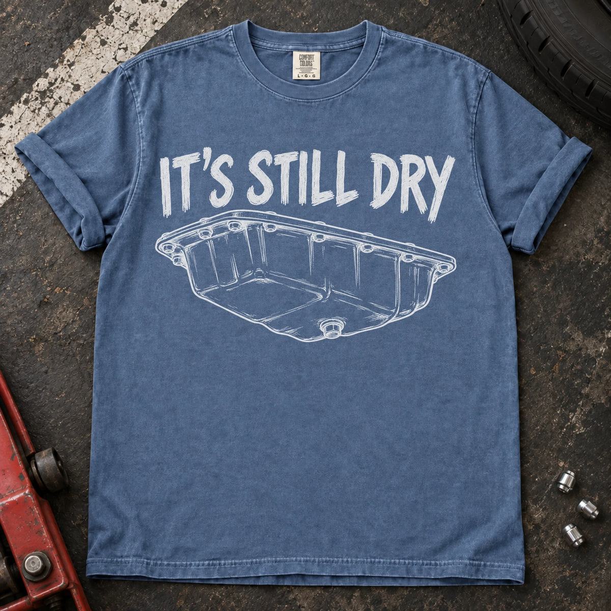 Blue Jean car enthusiast T-shirt. An oil-pan illustration makes it's still dry a cautious automotive joke.