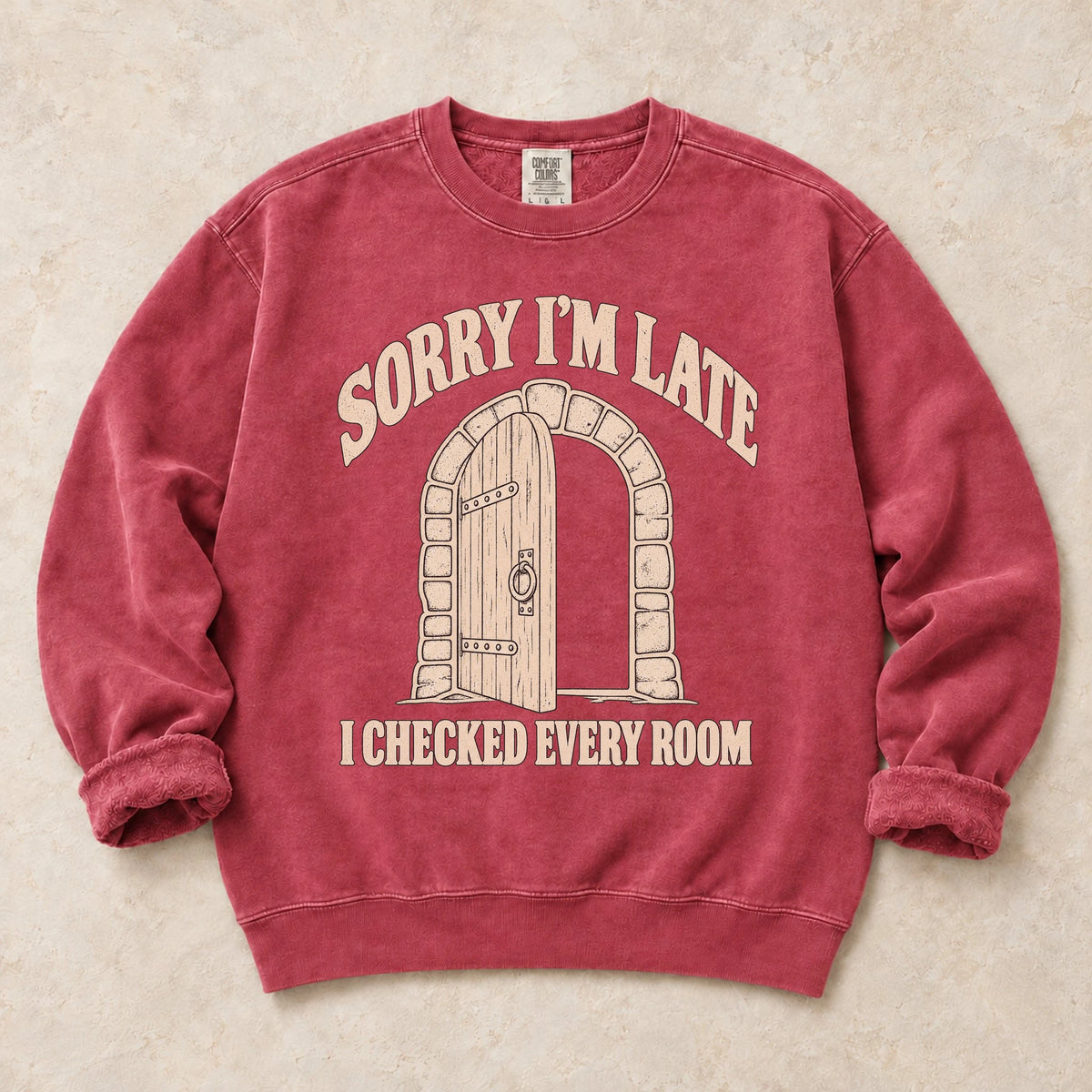 Crimson gaming sweatshirt. A dungeon door explains being late because every room got checked.