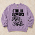Orchid garment-dyed crewneck sweatshirt with Customs Hold car parts design