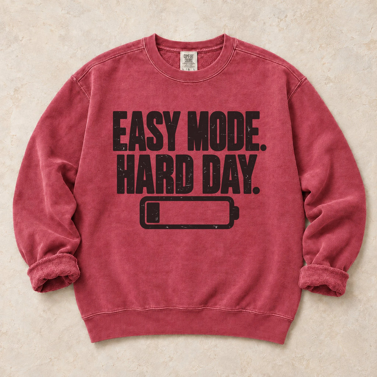 Crimson gaming sweatshirt. Easy mode, hard day, with a low battery for after-work gamers.