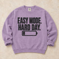 Orchid gaming sweatshirt. Easy mode, hard day, with a low battery for after-work gamers.