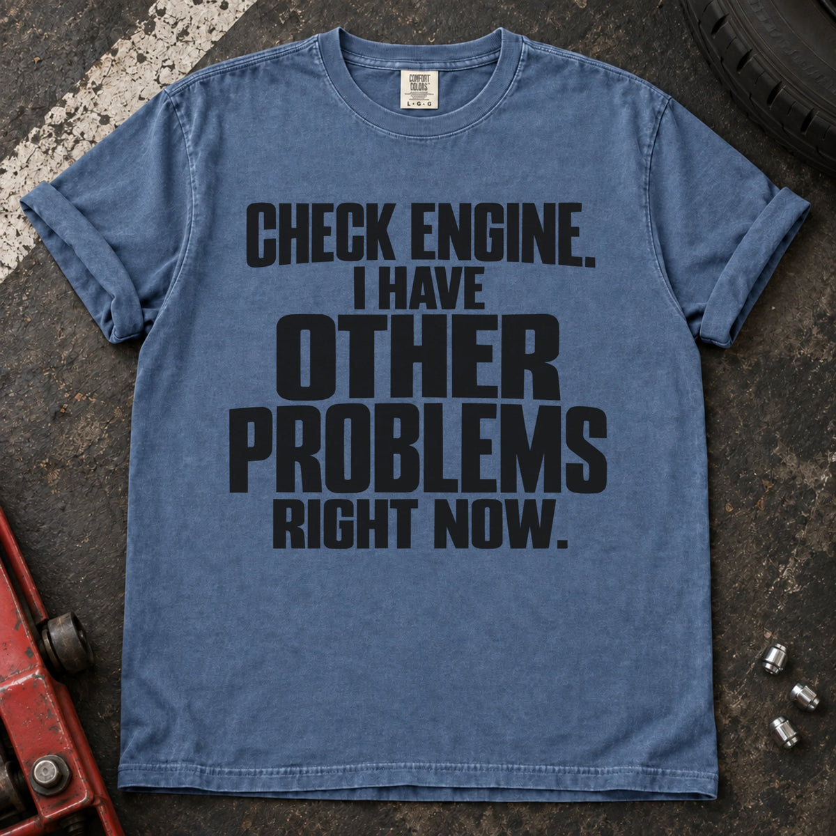 Blue Jean T-shirt reading 'Check engine. I have other problems right now' in stacked lettering.