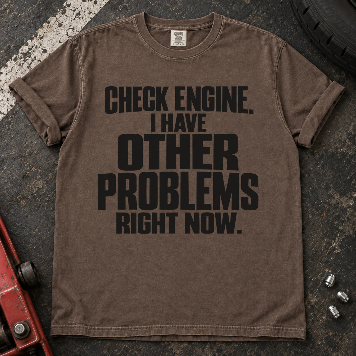 Espresso T-shirt reading 'Check engine. I have other problems right now' in stacked lettering.