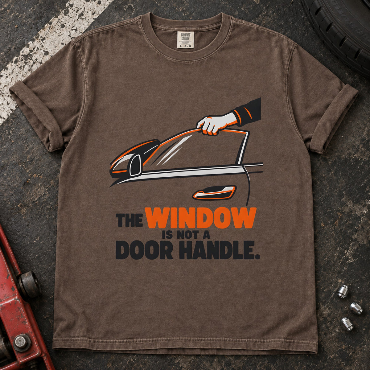 Espresso T-shirt showing a hand reaching through a car window with 'The window is not a door handle'.