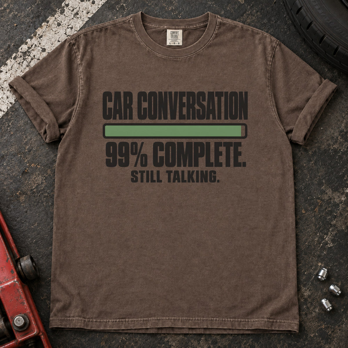 Espresso T-shirt showing a nearly full progress bar with 'Car conversation 99% complete. Still talking'.