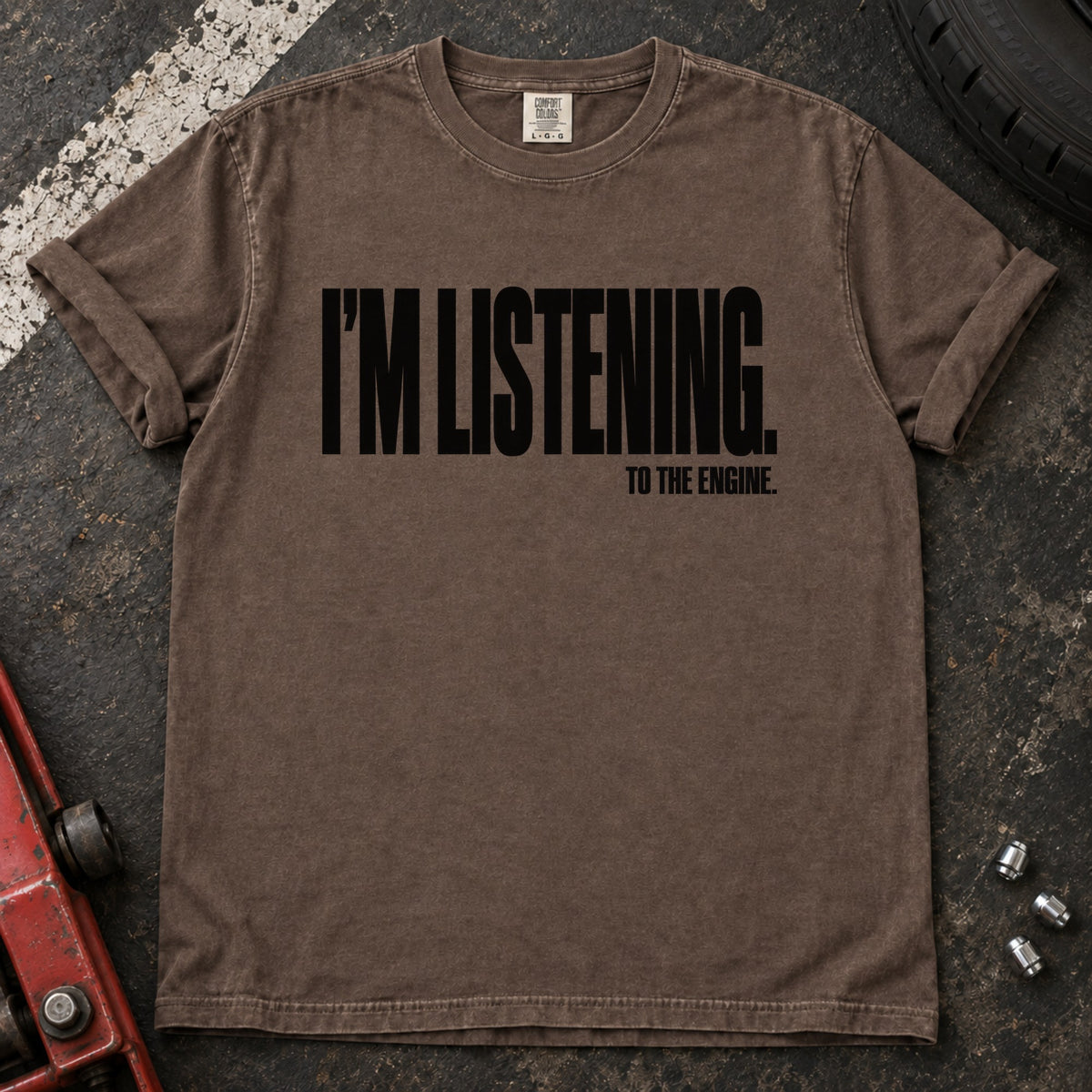 Espresso T-shirt with bold condensed lettering reading 'I'm listening to the engine'.