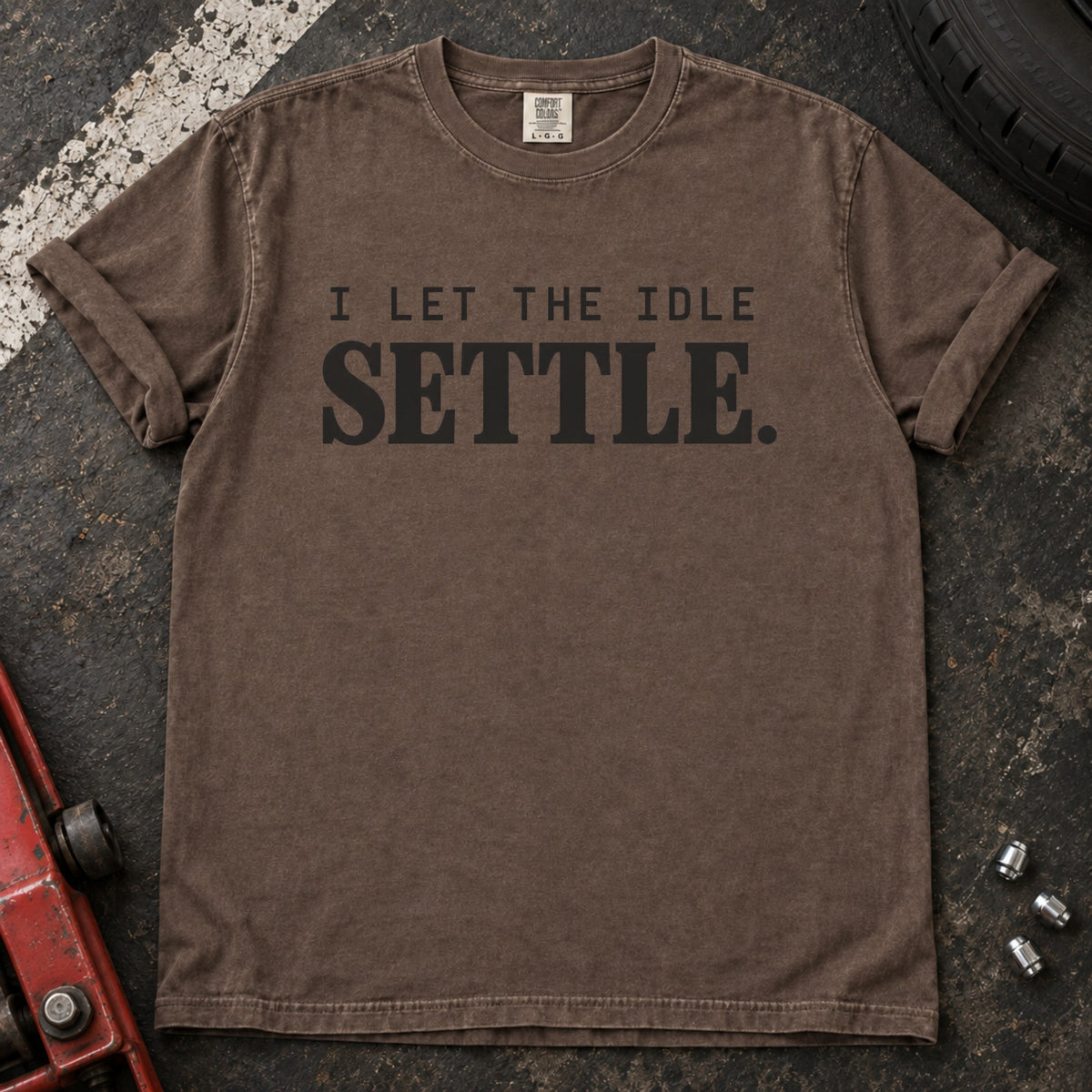 Espresso T-shirt with spaced lettering reading 'I let the idle settle'.