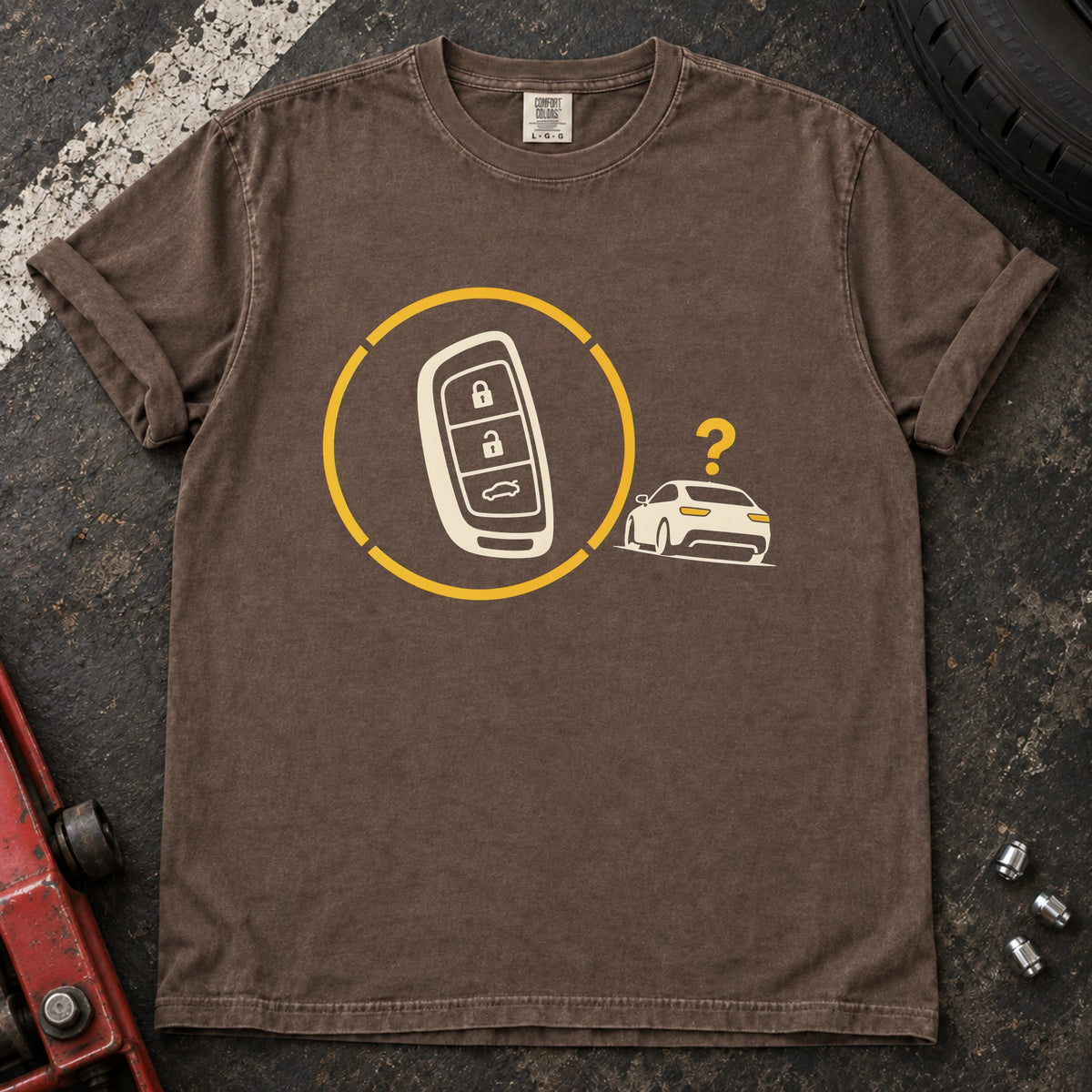 Espresso T-shirt with a key fob inside a circular signal graphic beside a small car and question mark.
