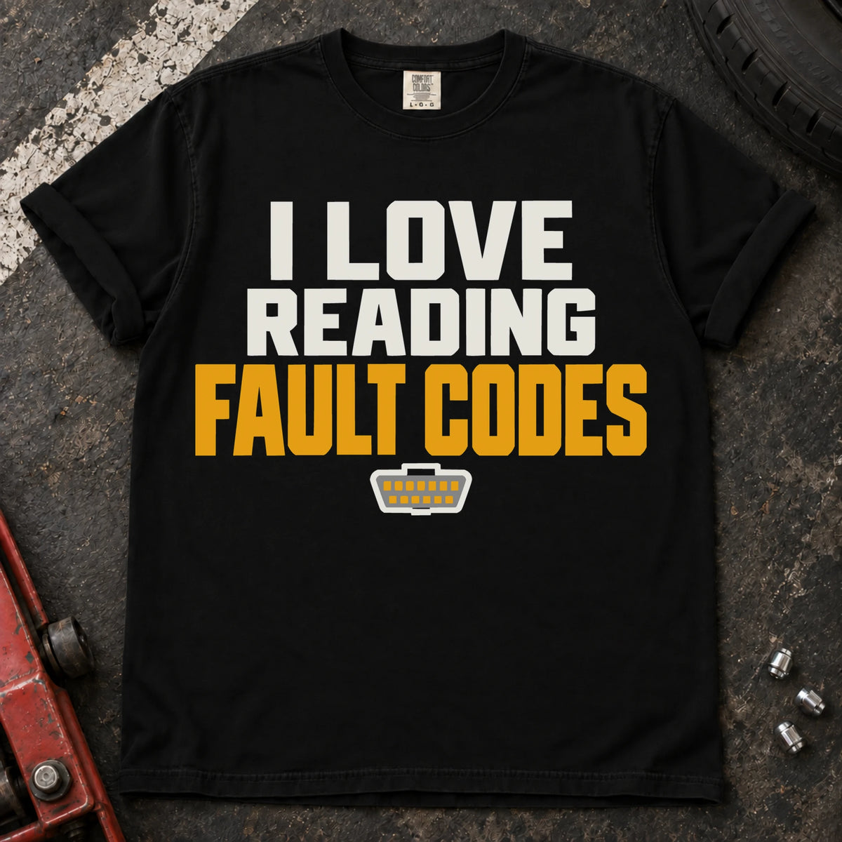 Black T-shirt reading 'I love reading fault codes' with a small diagnostic connector graphic.