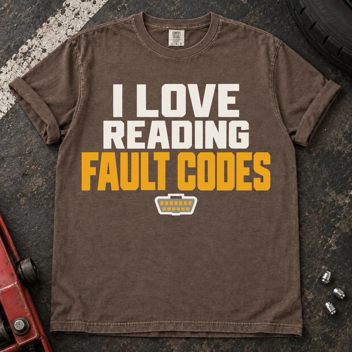 Espresso T-shirt reading 'I love reading fault codes' with a small diagnostic connector graphic.