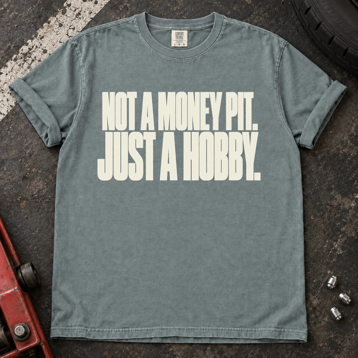 Bay car enthusiast T-shirt. Not a money pit, just a hobby: clean typography for the car-owner budget.