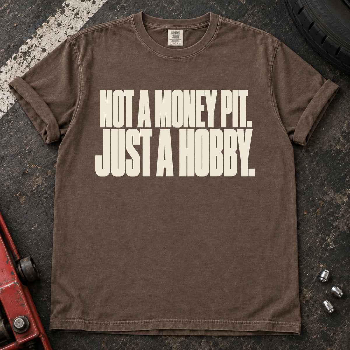 Espresso car enthusiast T-shirt. Not a money pit, just a hobby: clean typography for the car-owner budget.