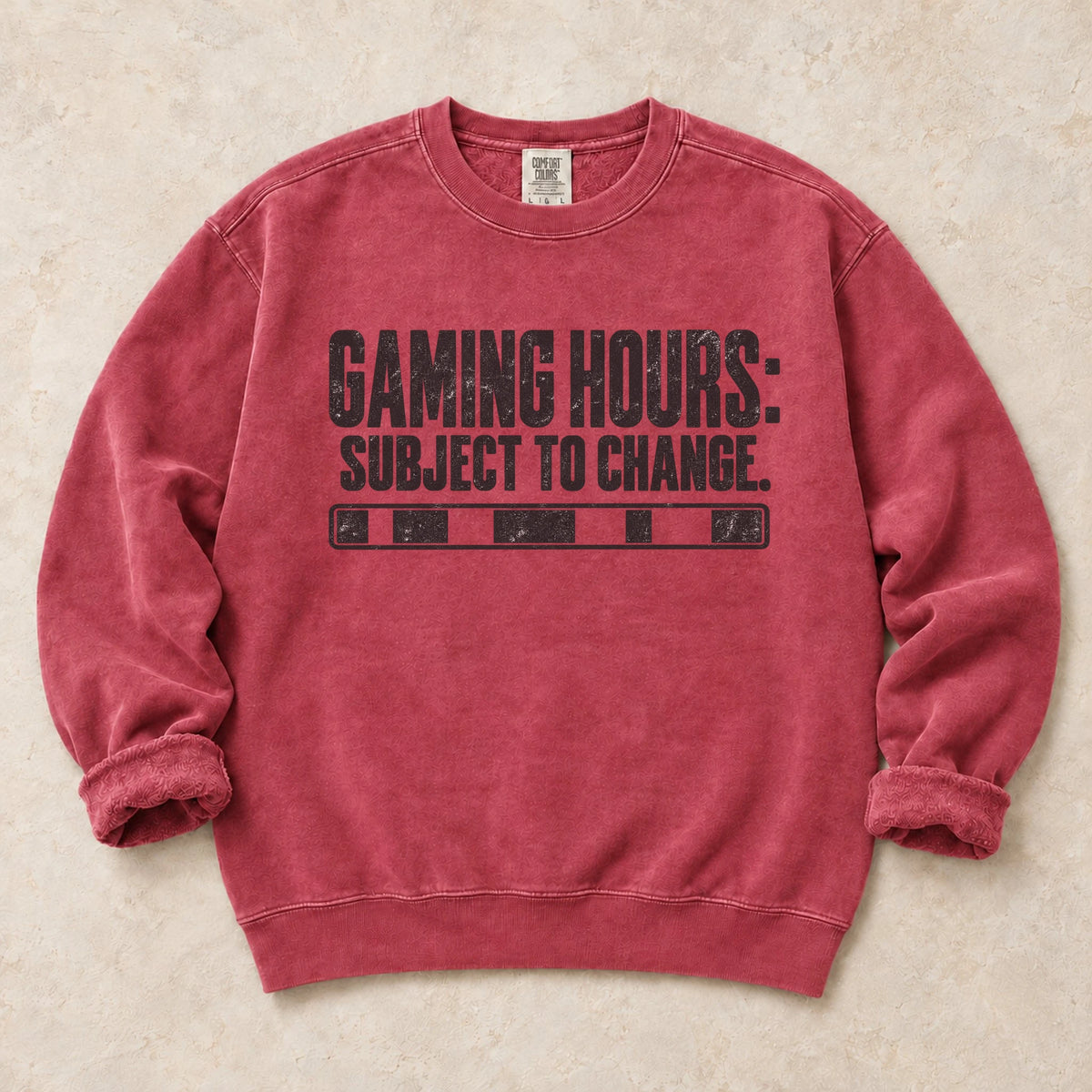 Crimson gaming sweatshirt. A row of status bars marks gaming hours subject to change.