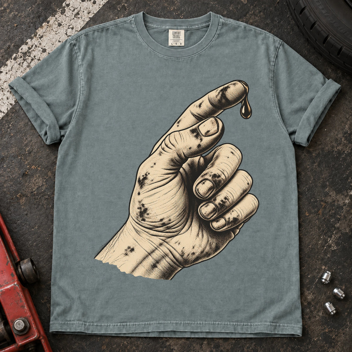 Bay car enthusiast T-shirt. An oily hand examines a drop of fluid in a text-free maintenance illustration.
