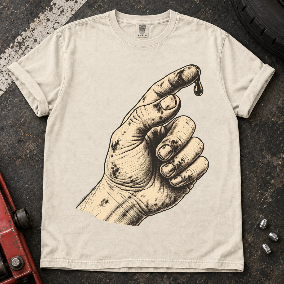 Ivory car enthusiast T-shirt. An oily hand examines a drop of fluid in a text-free maintenance illustration.