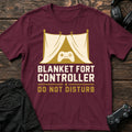 Maroon gaming T-shirt. A blanket-fort controller asks not to be disturbed.