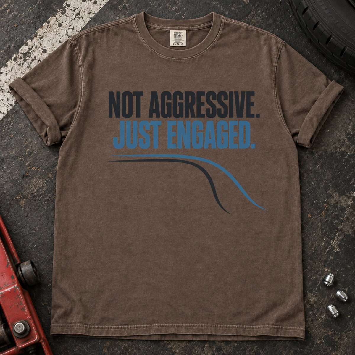 Espresso car enthusiast T-shirt. A cornering line explains not aggressive, just engaged.