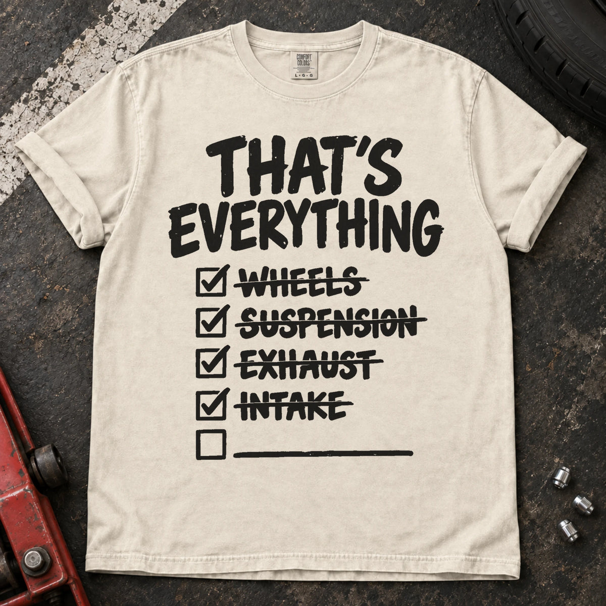 Ivory car enthusiast T-shirt. A modification checklist claims that's everything, with one empty line left.