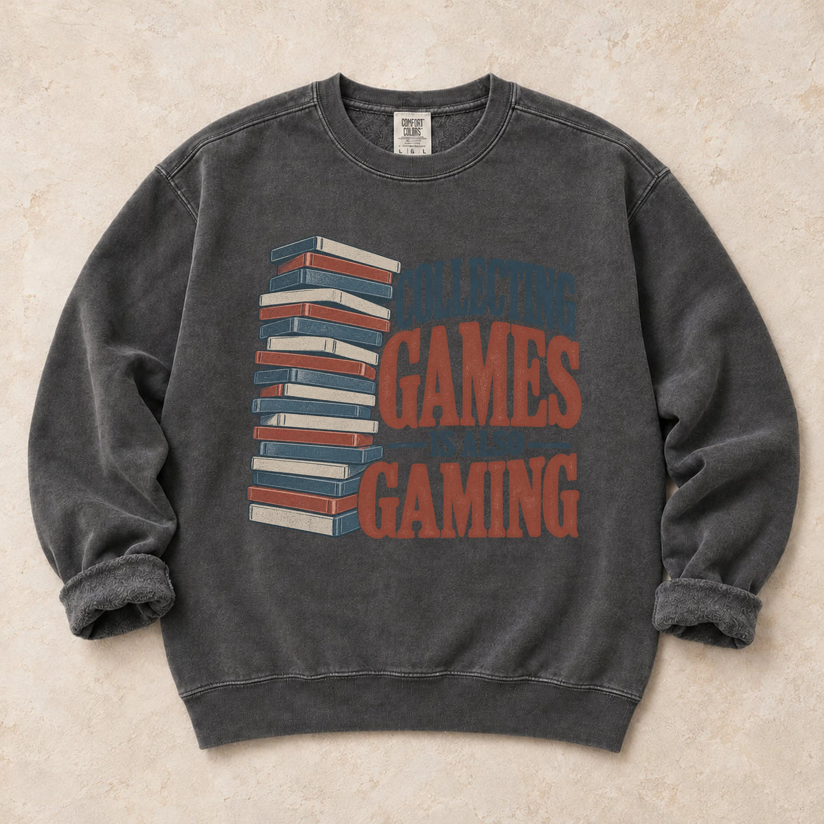 Pepper gaming sweatshirt. A tall stack of cases declares collecting games is also gaming.