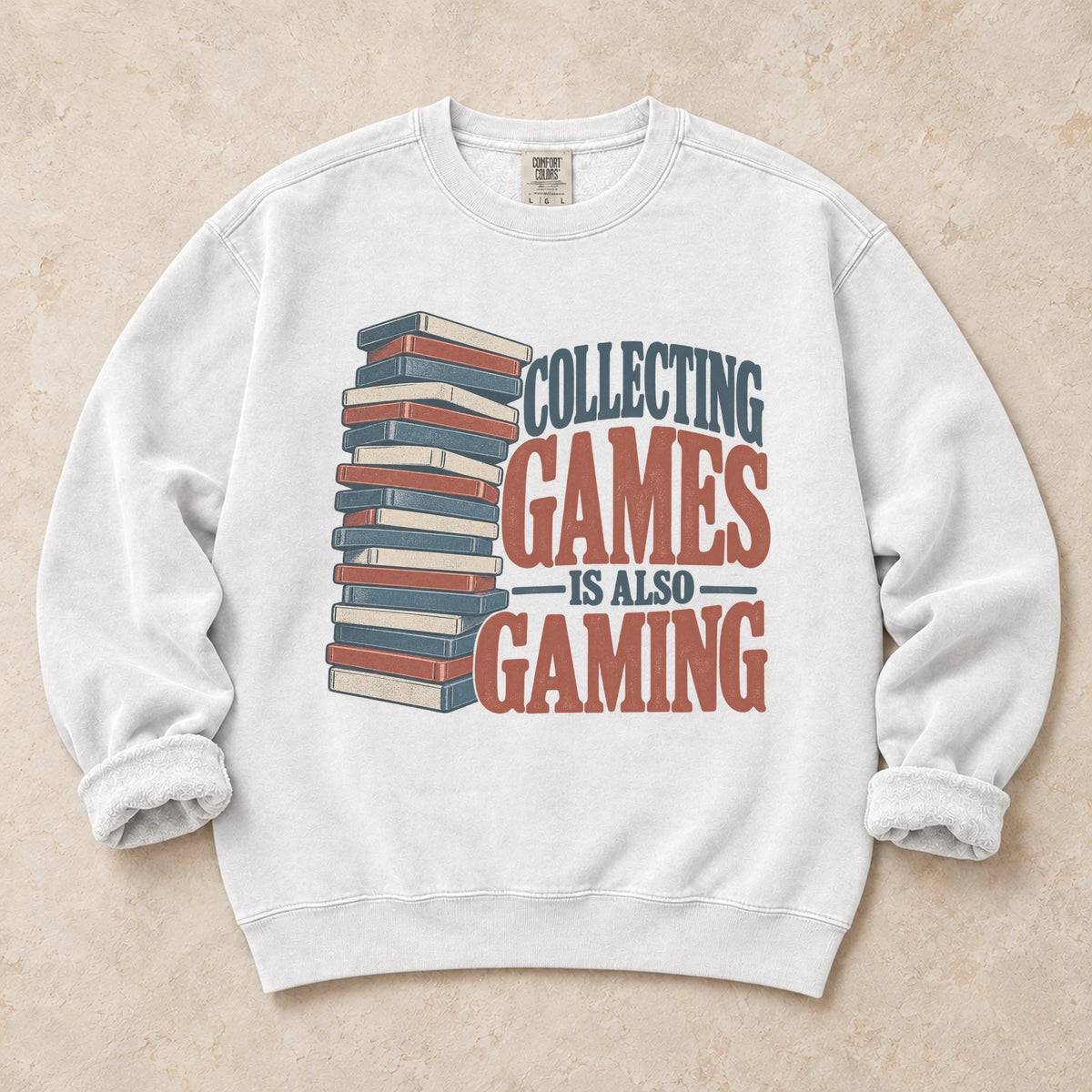 White gaming sweatshirt. A tall stack of cases declares collecting games is also gaming.