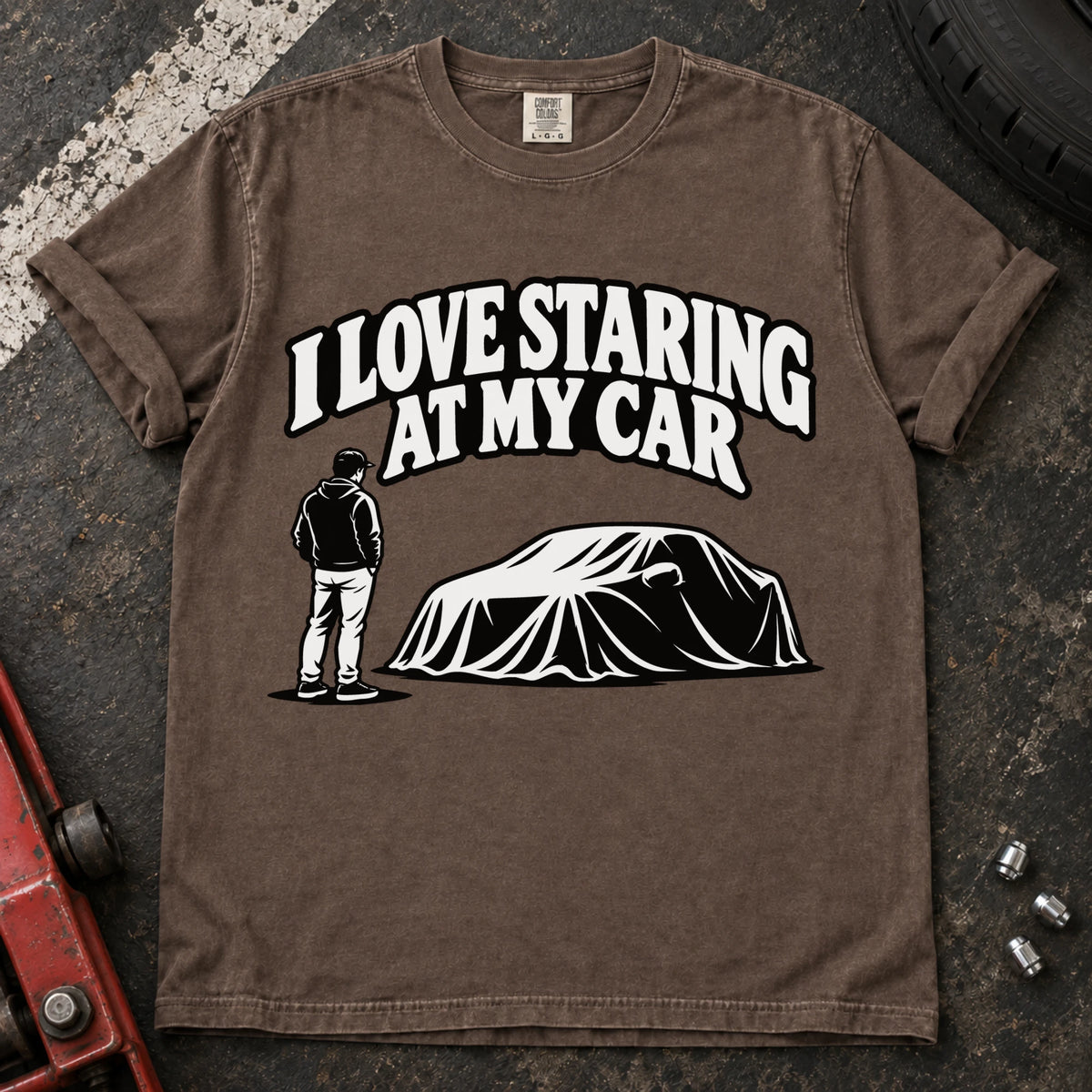 Espresso T-shirt showing a person beside a covered car under 'I love staring at my car'.