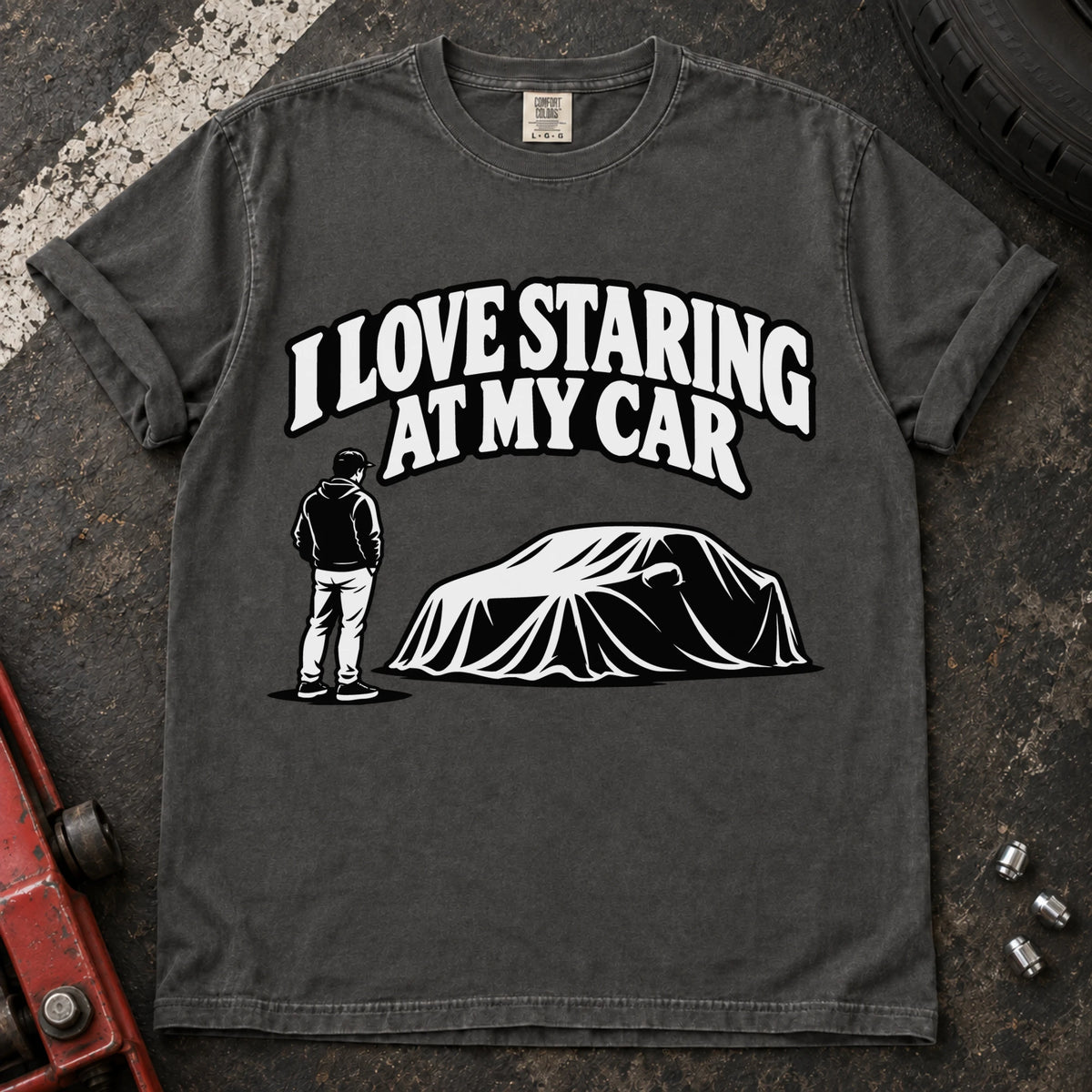 Pepper T-shirt showing a person beside a covered car under 'I love staring at my car'.