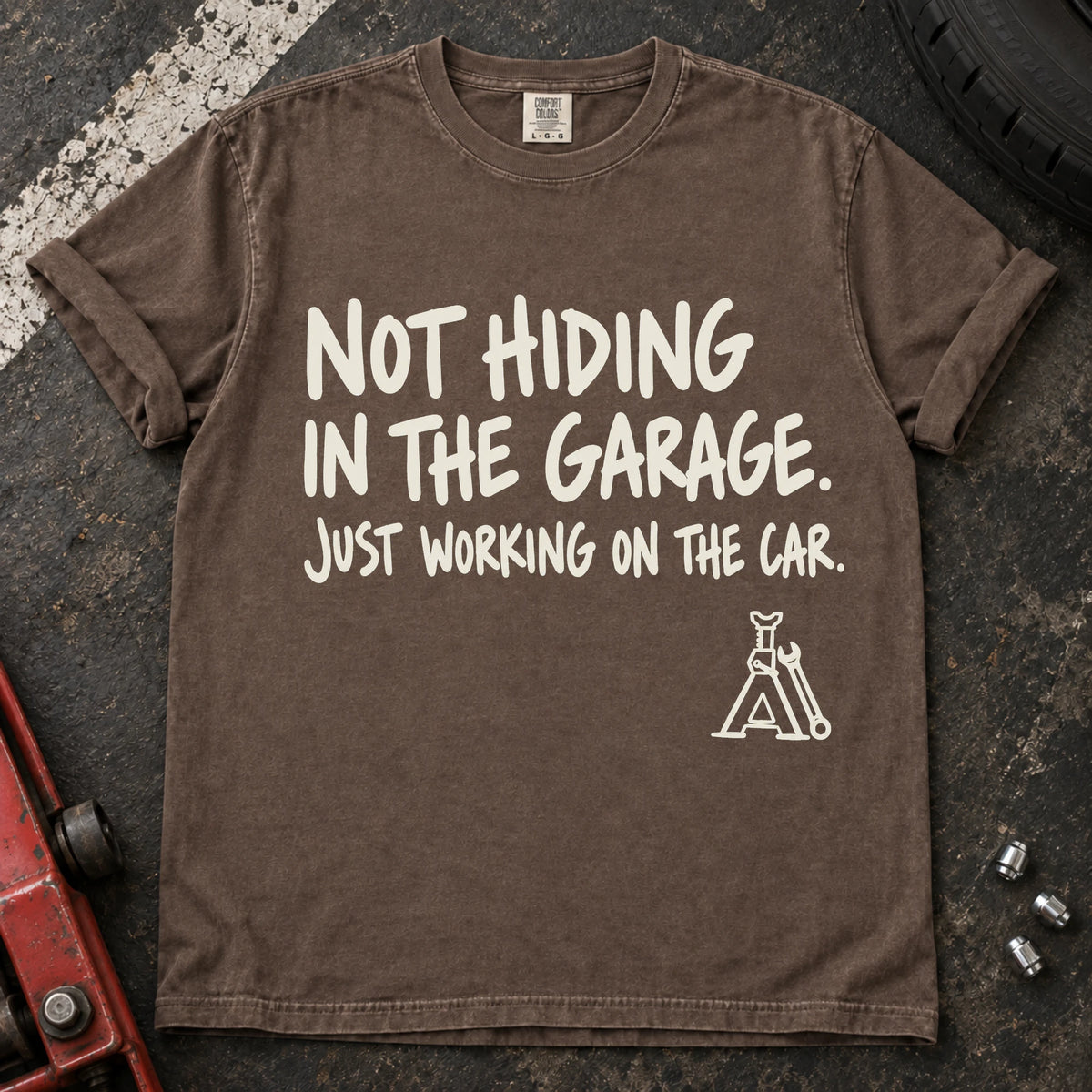 Espresso car enthusiast T-shirt. A jack stand backs not hiding in the garage, just working on the car.