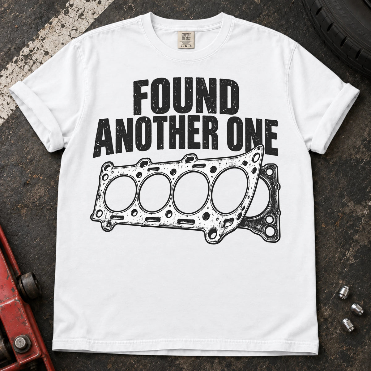 White car enthusiast T-shirt. Layered head gaskets and found another one lettering capture recurring repair humor.