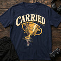 Navy gaming T-shirt. A tiny hand lifts a huge golden trophy under Carried.