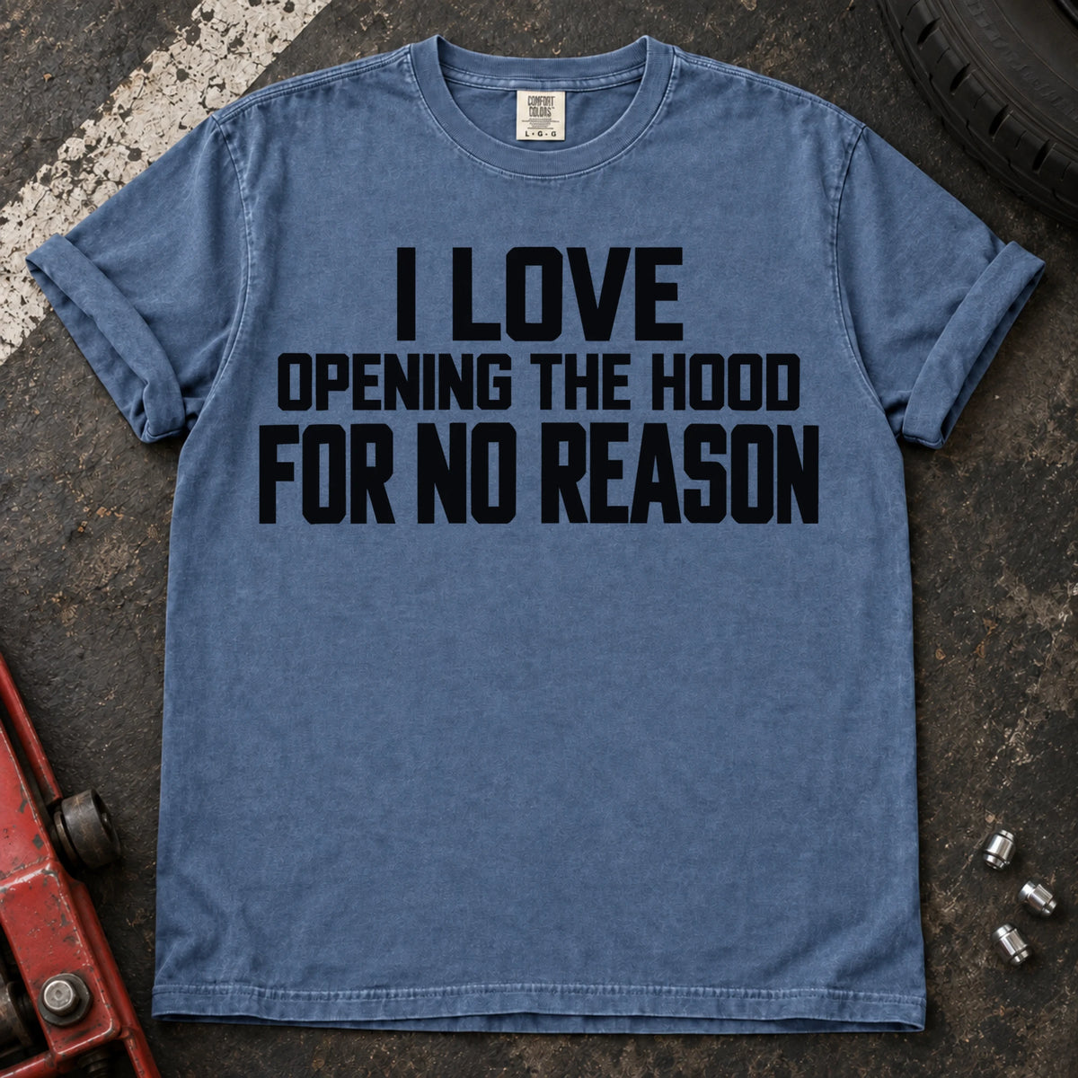 Blue Jean T-shirt with bold lettering reading 'I love opening the hood for no reason'.