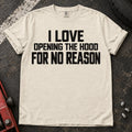 Ivory T-shirt with bold lettering reading 'I love opening the hood for no reason'.