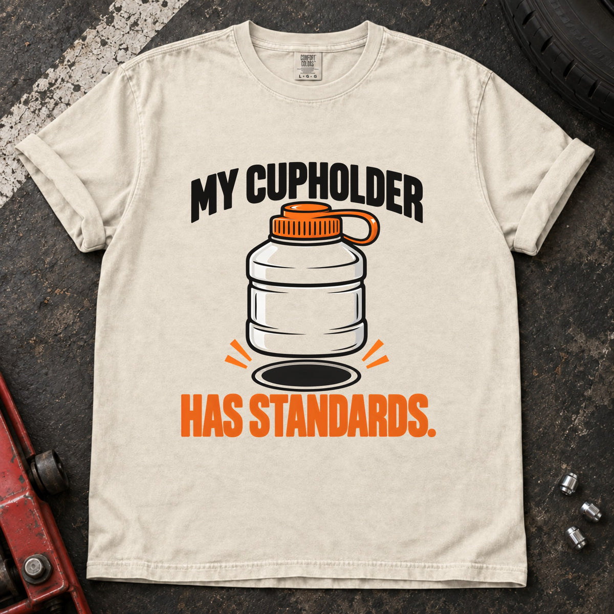 Ivory T-shirt showing an oversized bottle and cupholder with 'My cupholder has standards'.