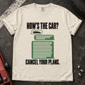 Ivory T-shirt showing a green tool cabinet under 'How's the car? Cancel your plans'.